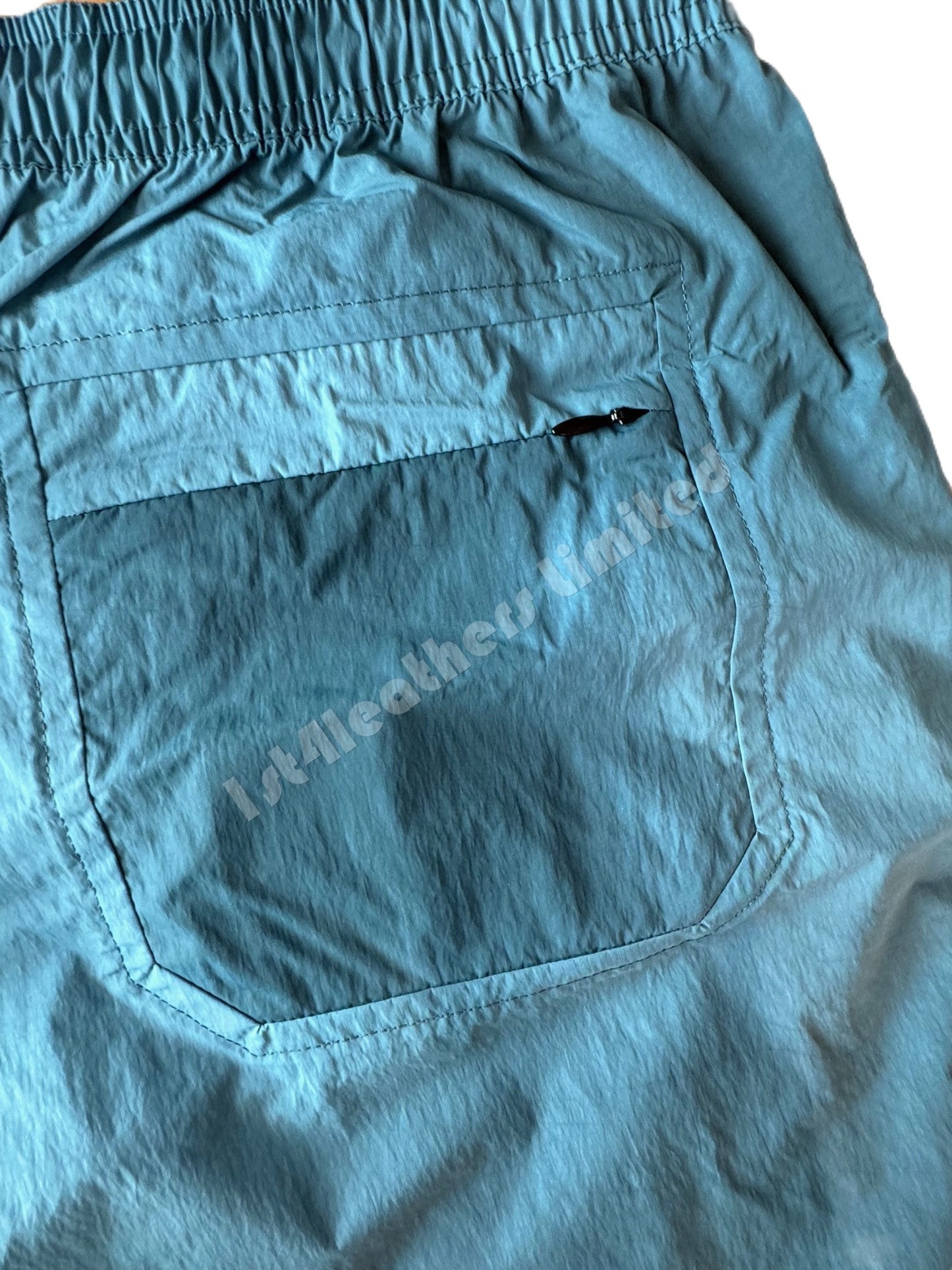 BELSTAFF BREAKER RIPPLE SHELL SHORTS IN WAVE DYE OCEAN BLUE RRP £175